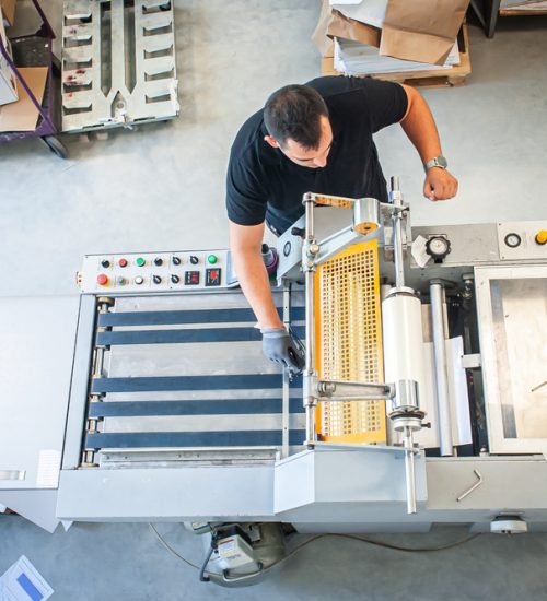 UV flatbed printing machine producing vibrant, high-quality prints by Vibrant Colour