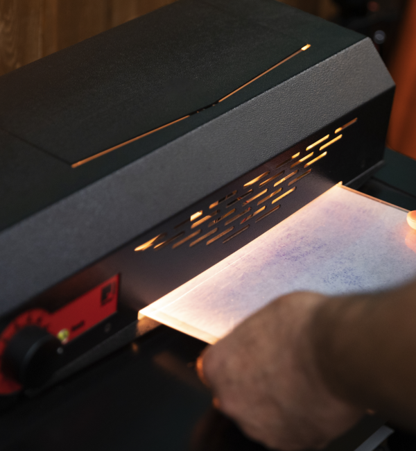 High-precision UV flatbed printer creating vivid, detailed prints at Vibrant Colour